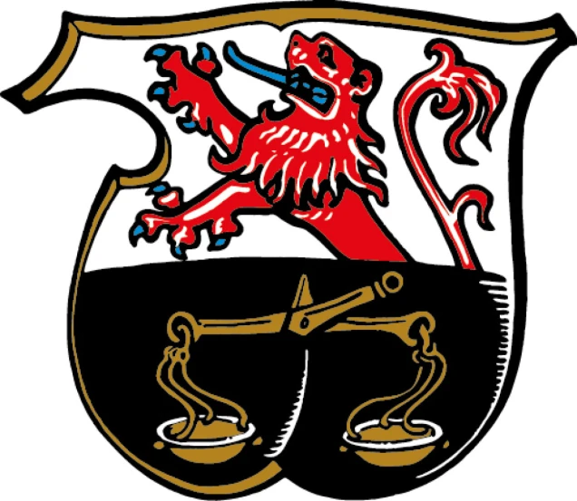 Ein Wappen mit einem roten, aufgerichteten Löwen mit blauer Zunge auf weißem Hintergrund oben und einer goldenen Waage auf schwarzem Hintergrund unten.