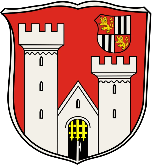 Wappen mit rotem Hintergrund, zwei weißen Türmen, einem Tor mit gelbem Fallgitter in der Mitte und einem kleineren Wappen oben rechts.