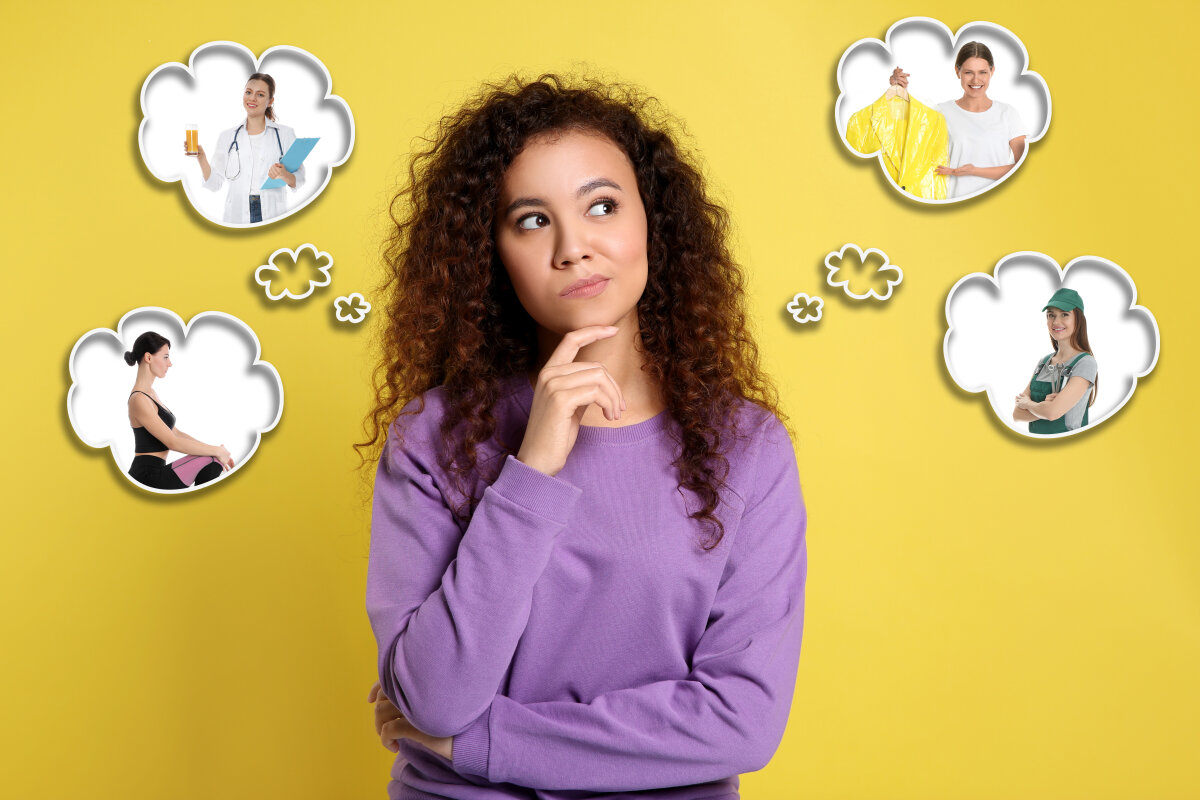 Thoughtful African American woman choosing probable profession on yellow background