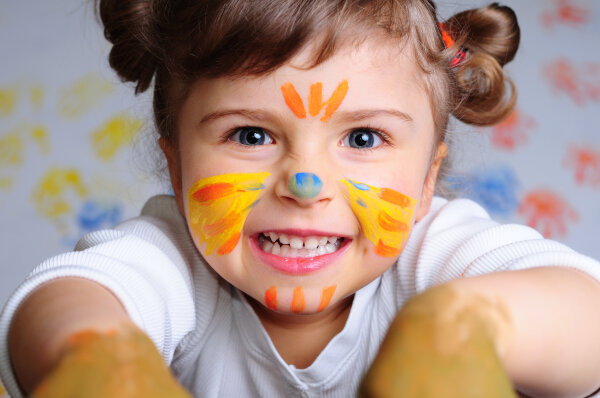 Little girl playing with colors